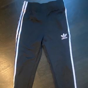 Adidas kids black track pants with white stripes on side. SiE 9-10